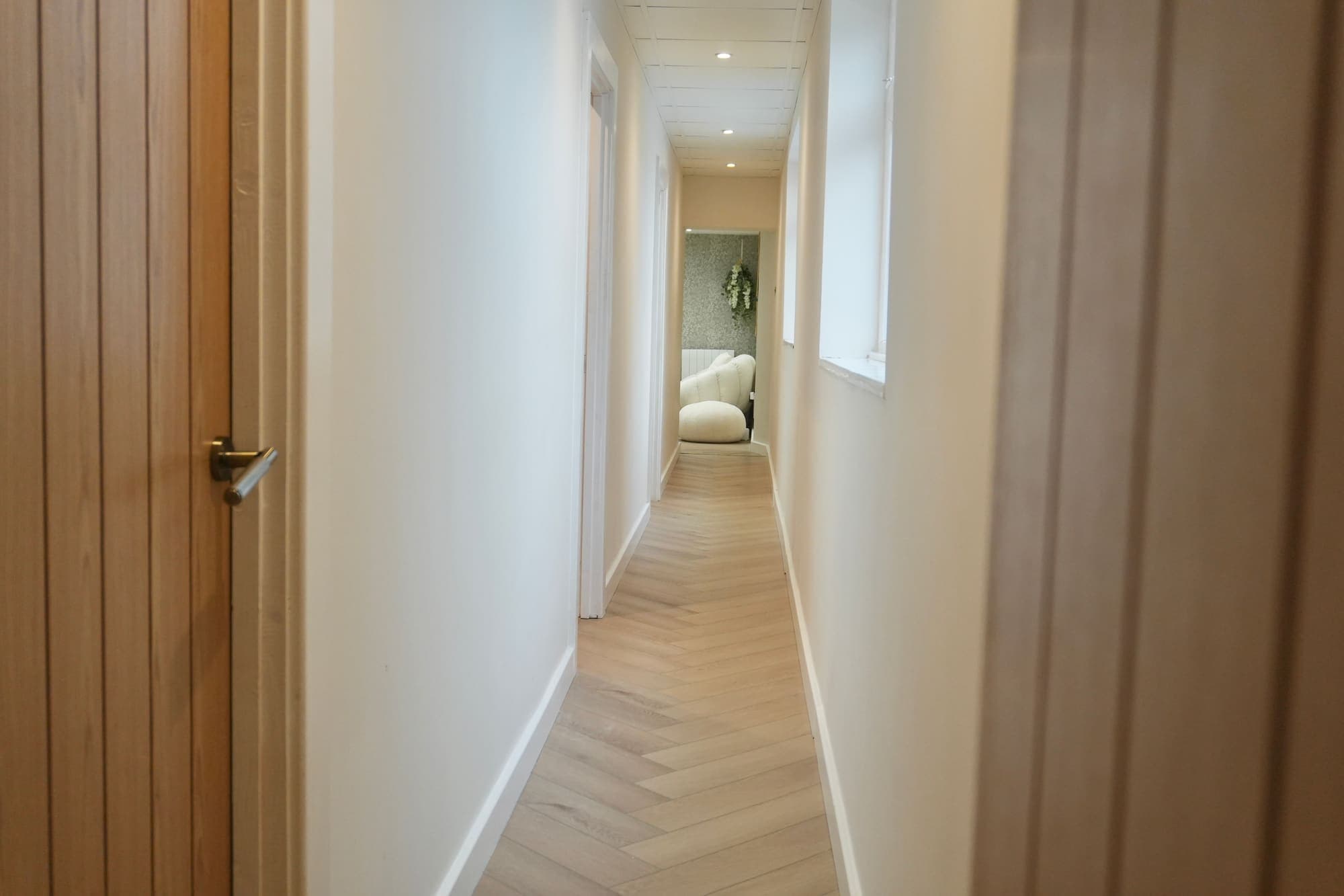 The bright treatment-room corridor at Totally Transformed, Forest Hall, Newcastle
